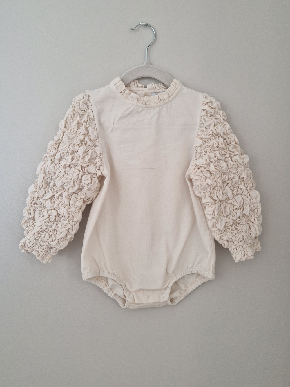 Cream Ruffle Sleeve Infant One-Piece Bodysuit